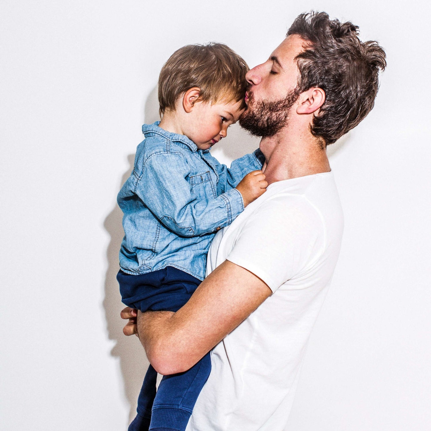 father holding his son