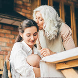 lady kissing her daughter 