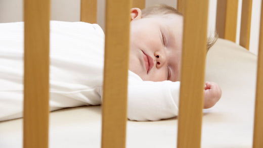 Baby Sleeping in its Cot