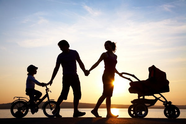family walking at sunset