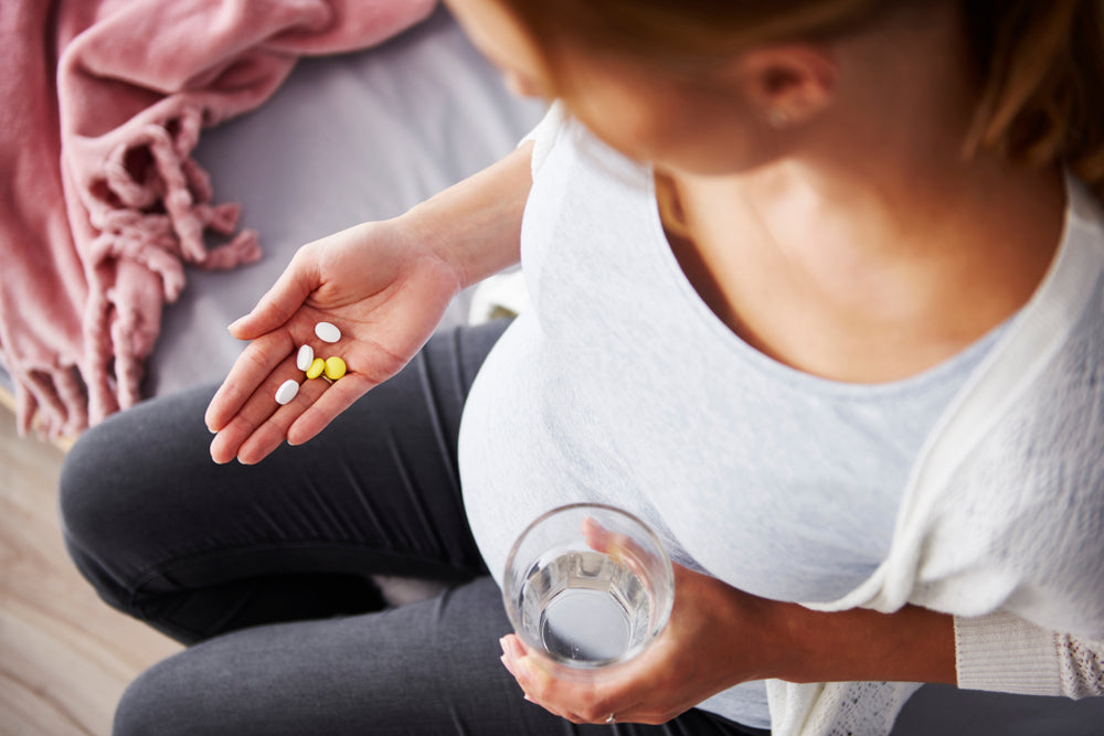 Pregnancy woman taking supplements
