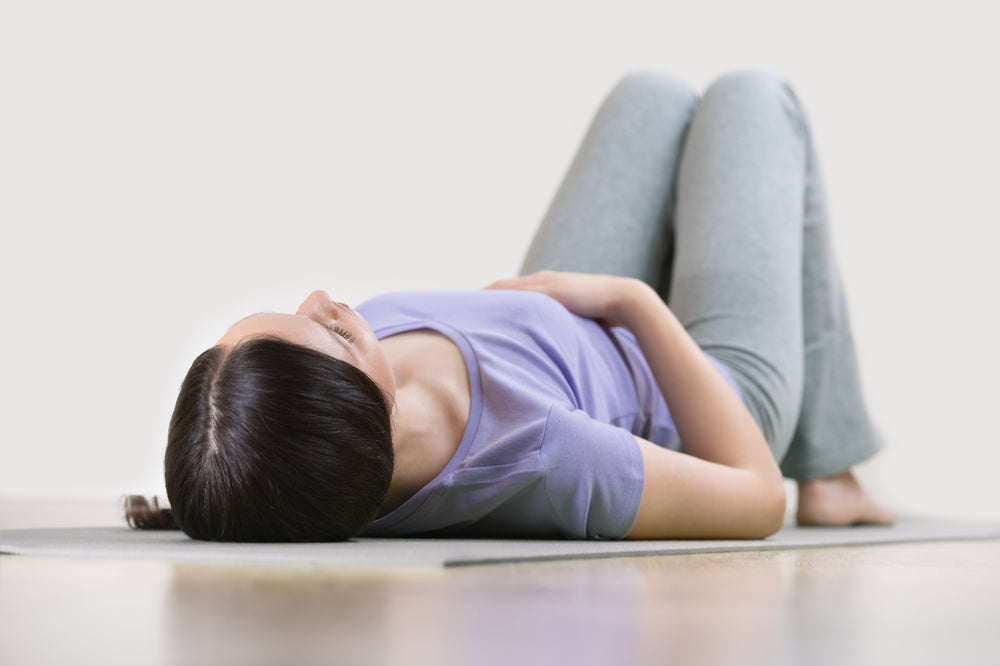Mother lying down on back | Nourish Baby