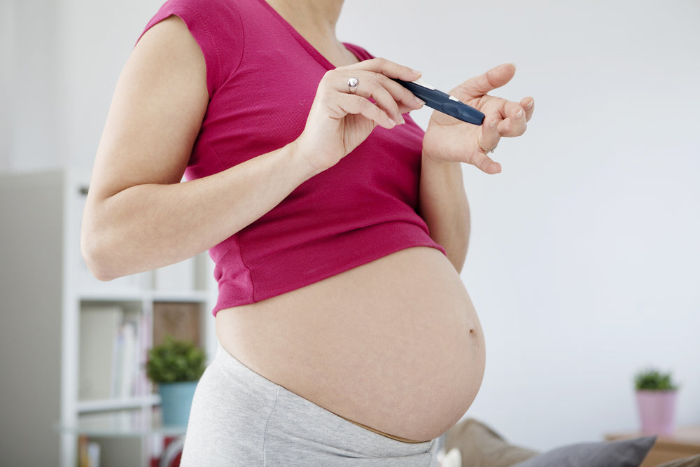 Pregnant woman taking test for diabetes | Nourish Baby