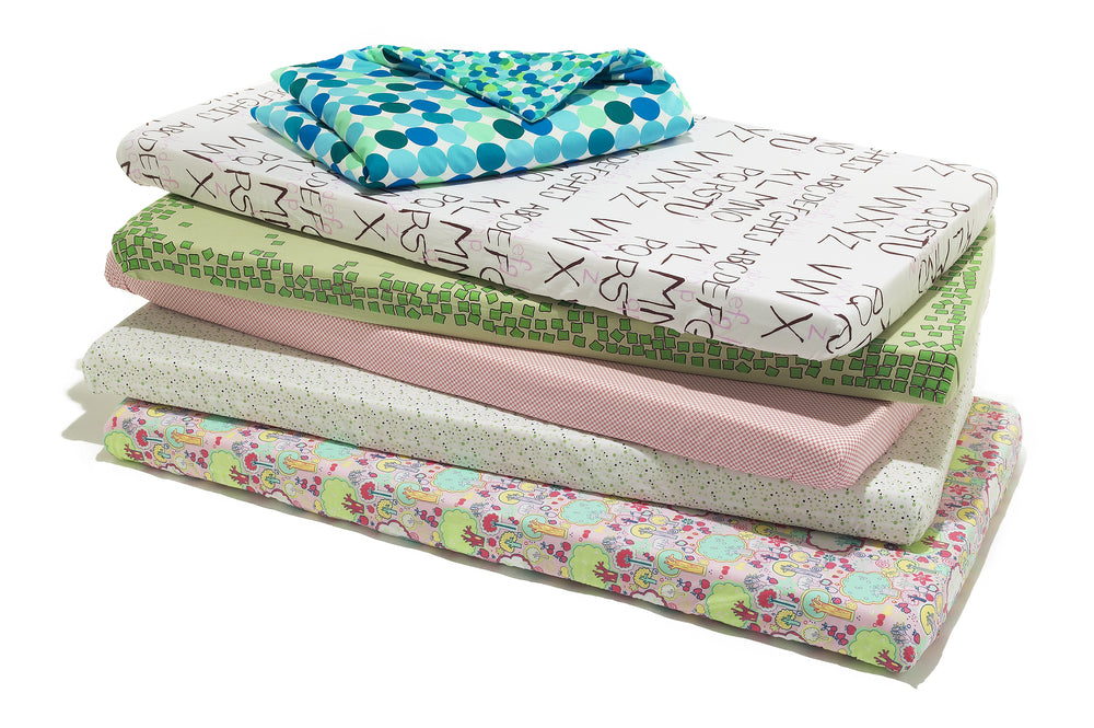 Cot mattresses stacked | Nourish Baby