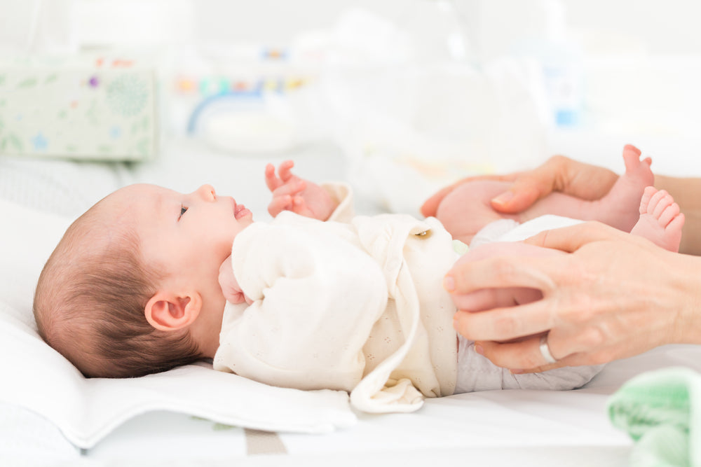 Baby having hips checked | Nourish Baby