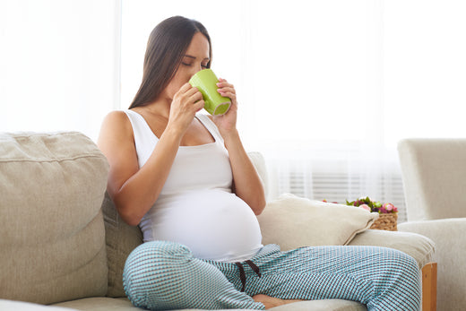 Pregnant woman drinking tea