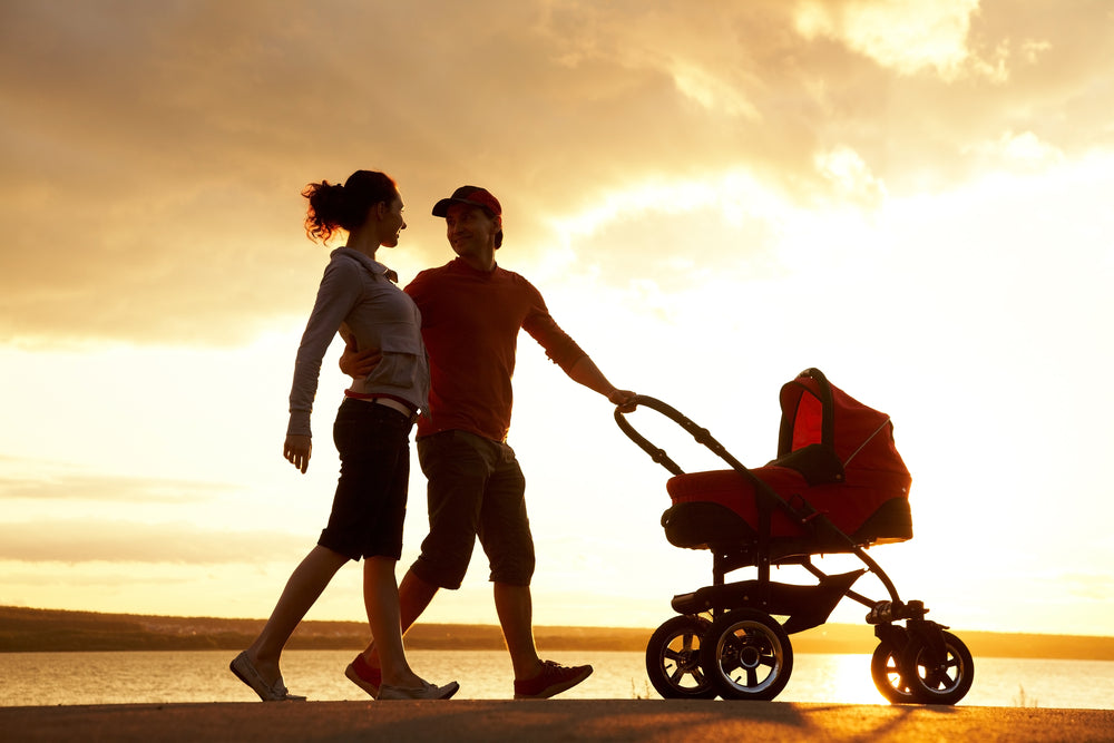 Couple with a pram | Nourish Baby