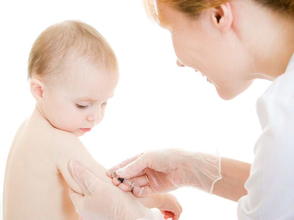 Young baby getting vaccinated | Nourish Baby